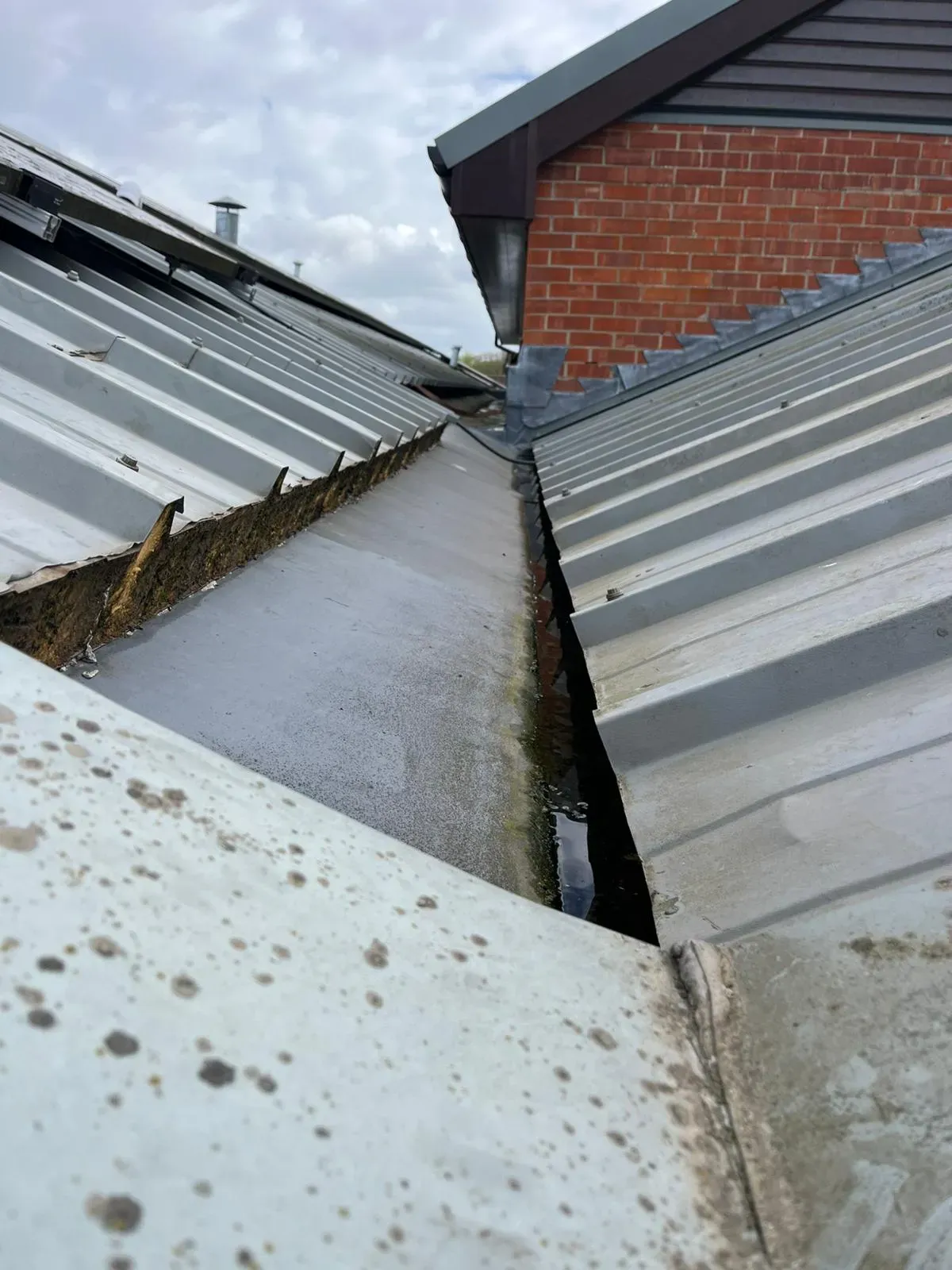 Industrial metal roof gutter maintenance and cleaning in Felixstowe
