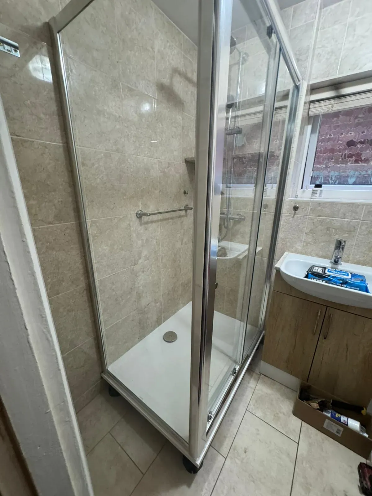 A professional walk-in shower and bathroom sink installation in Felixstowe.