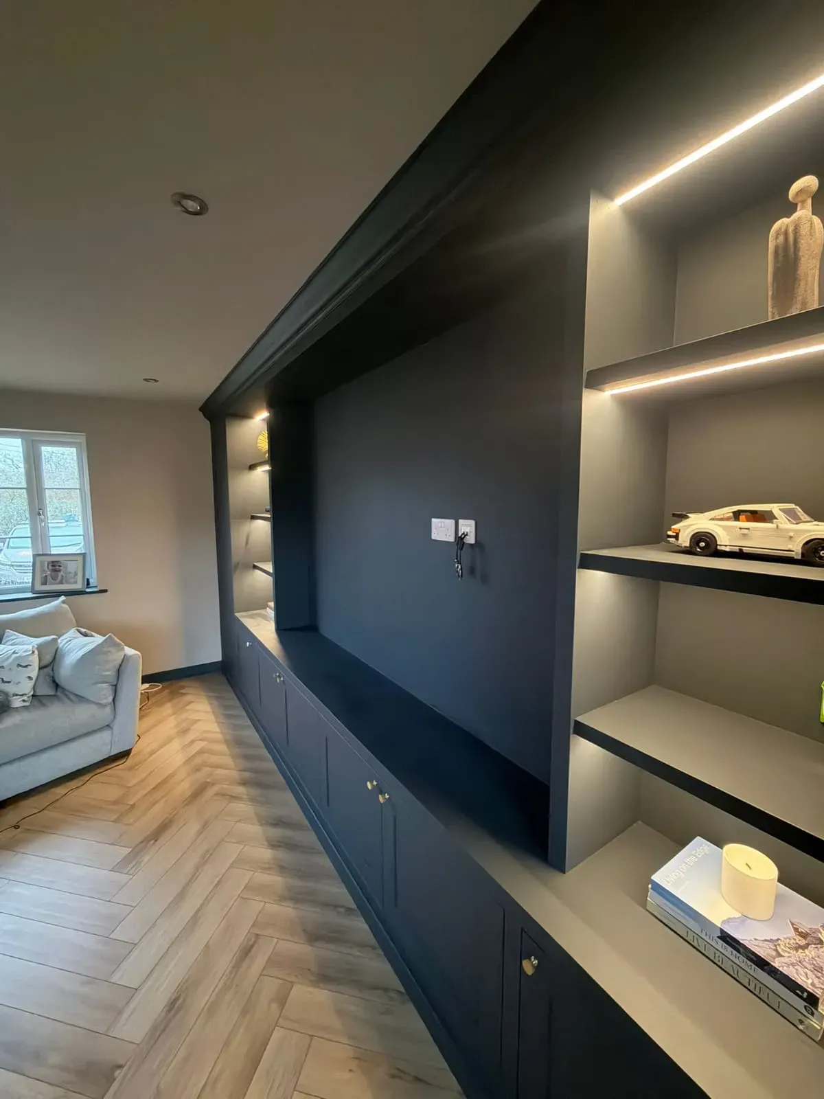 Bespoke carpentry and joinery media unit with integrated lighting by FLEX PROPERTY SERVICES